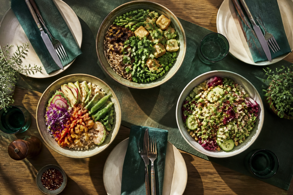 Illustration of varied lunch bowls on a communal dining table