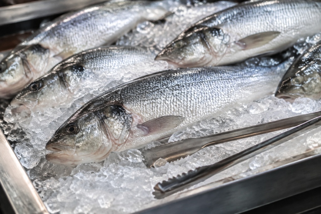 Whole fish on crushed ice in an unbranded market tray
