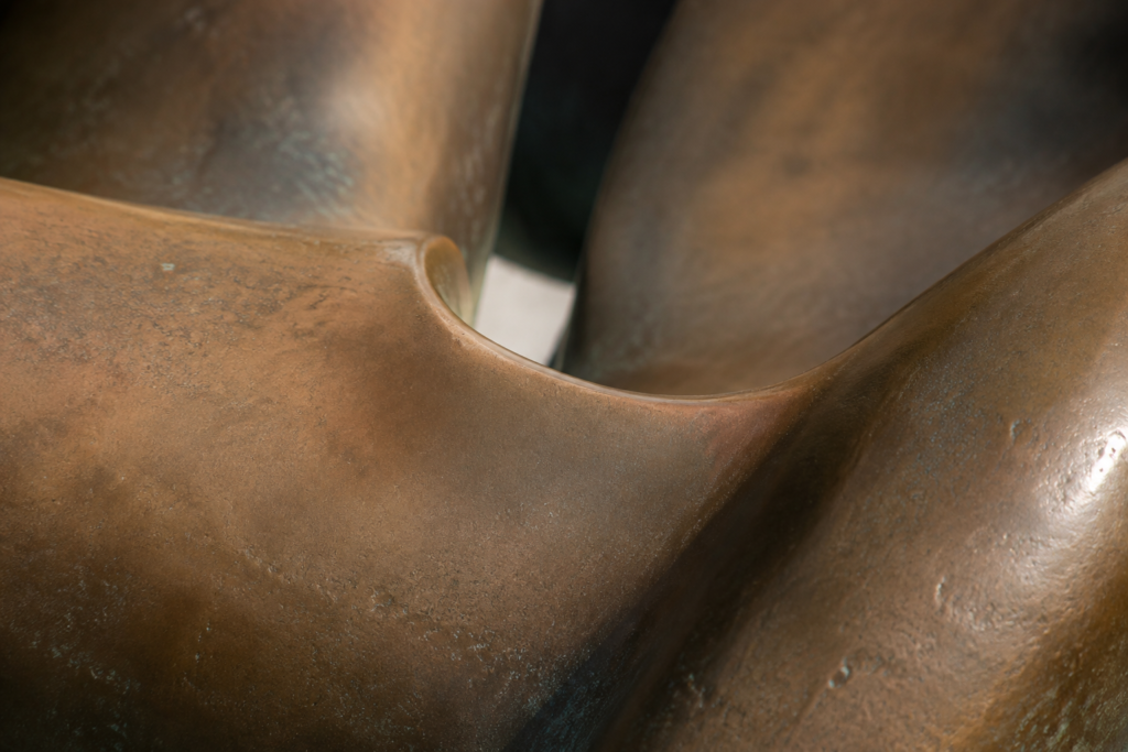 Curves and patina on an abstract bronze form — conceptual image