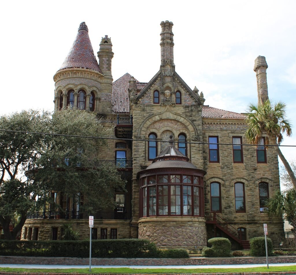 Side elevation of Bishop’s Palace in Galveston, showing its bay windows and stonework