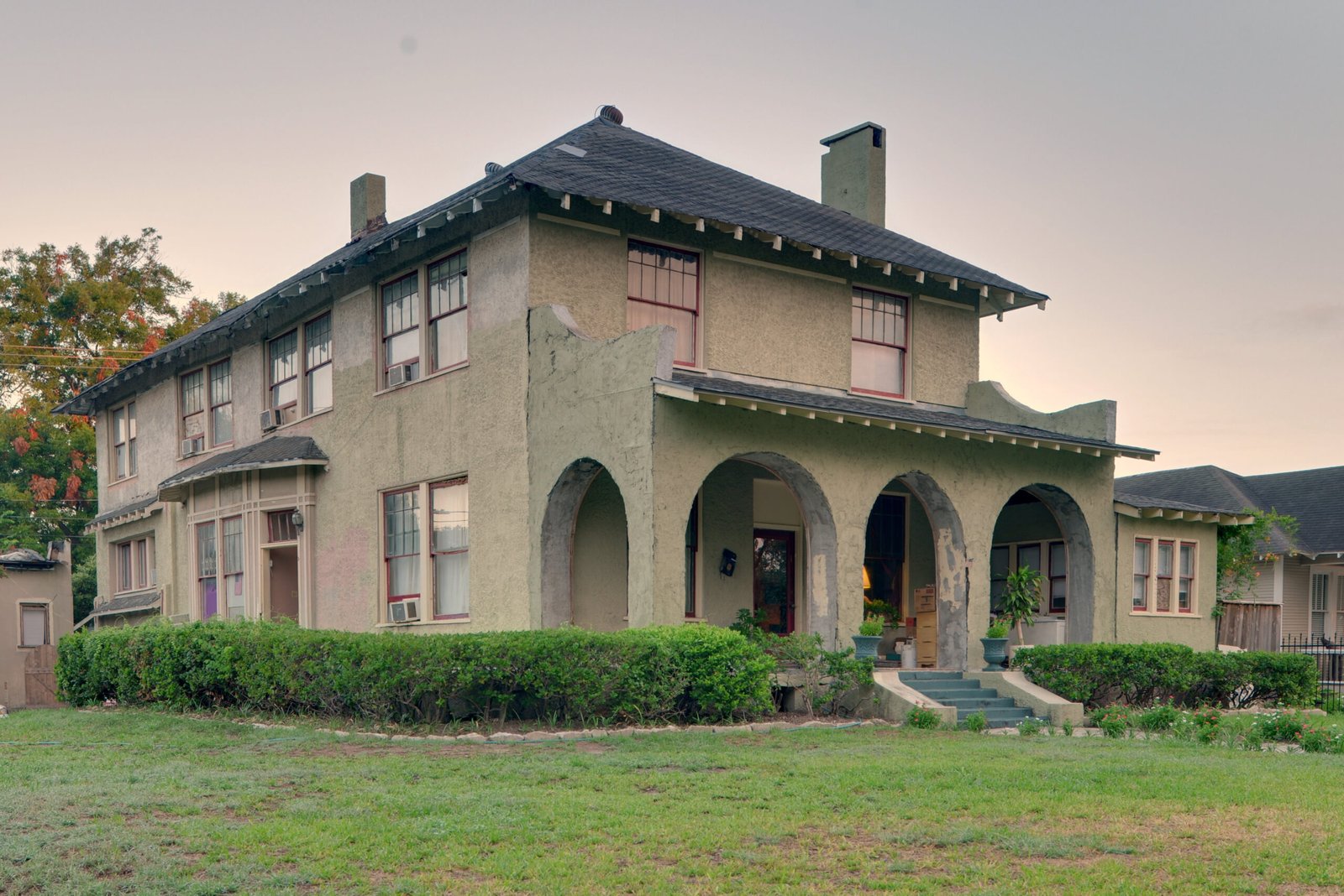 Hawkins House on Heights Boulevard, with stucco walls and arched porch openings, photographed in July 2011.